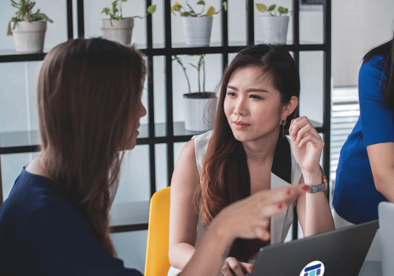 Consultants working together in conversation